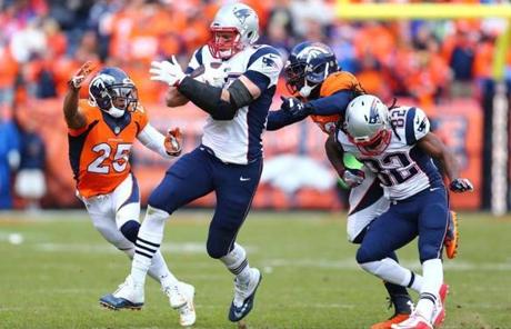 New England Patriots tight end Rob Gronkowski ran past Denver Broncos cornerback Chris Harris in the third quarter.
